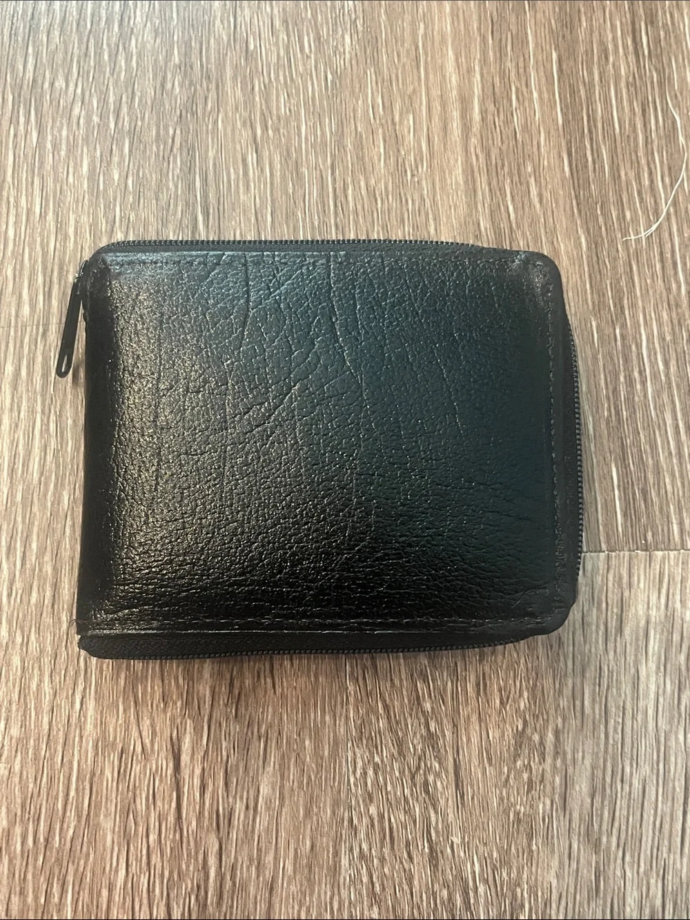 split Black Leather Zip-Around Wallet with Gold Accents